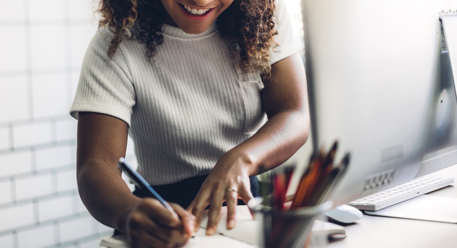 African American Black Woman Working with Laptop Computer.Creati